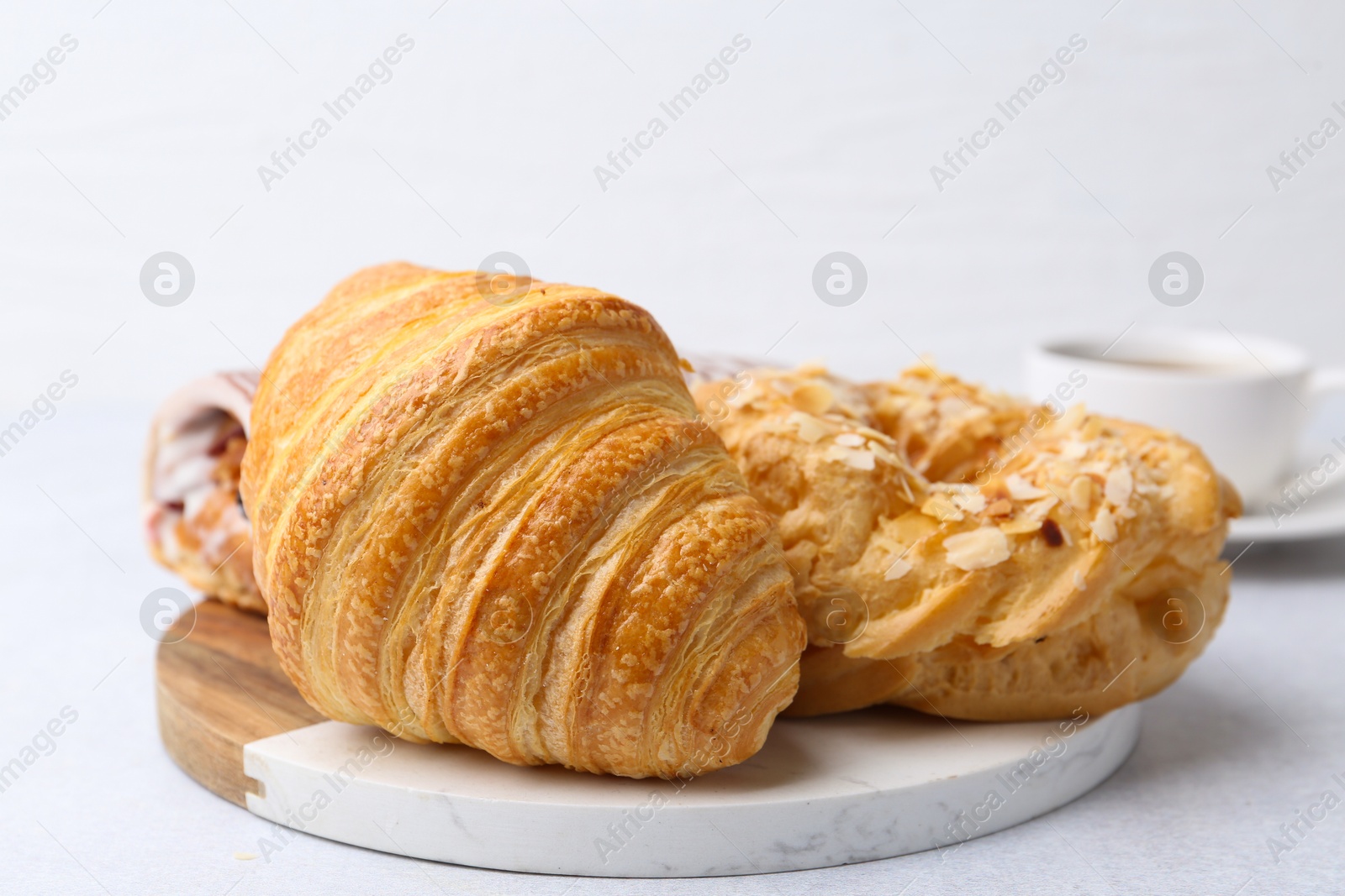 Photo of Different sweet pastries on light table, closeup