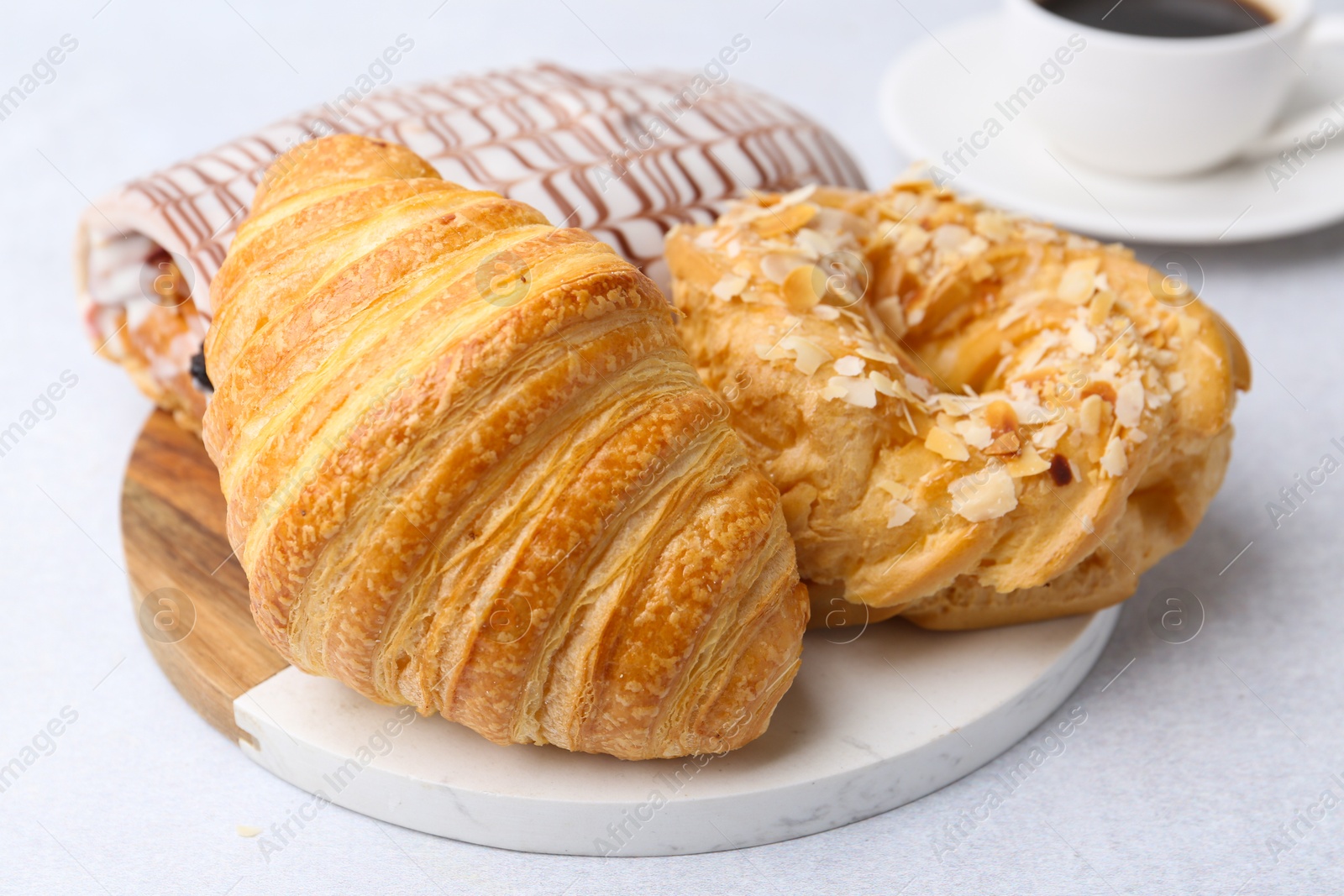 Photo of Different sweet pastries on light table, closeup