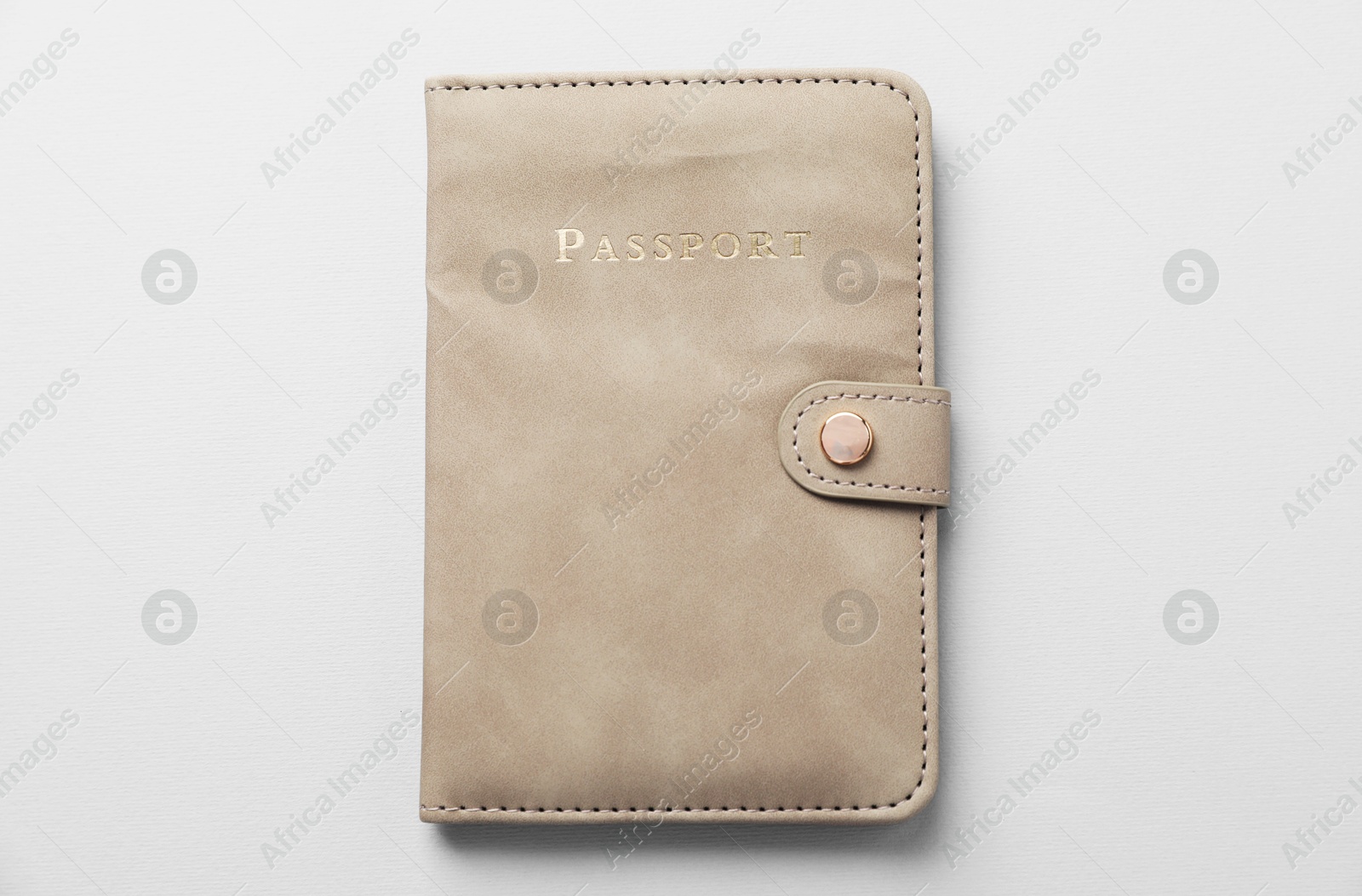 Photo of Passport in leather cover on grey background, top view