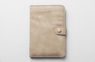 Photo of Passport in leather cover on grey background, top view