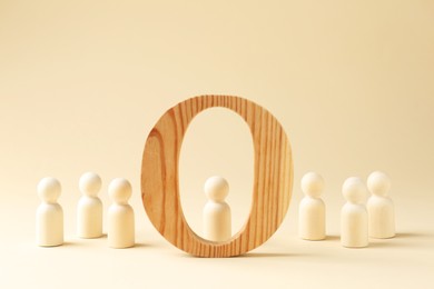 Photo of Competition concept. Human figures and wooden circle on beige background