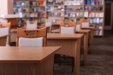 Photo of Desks and chairs in public library room