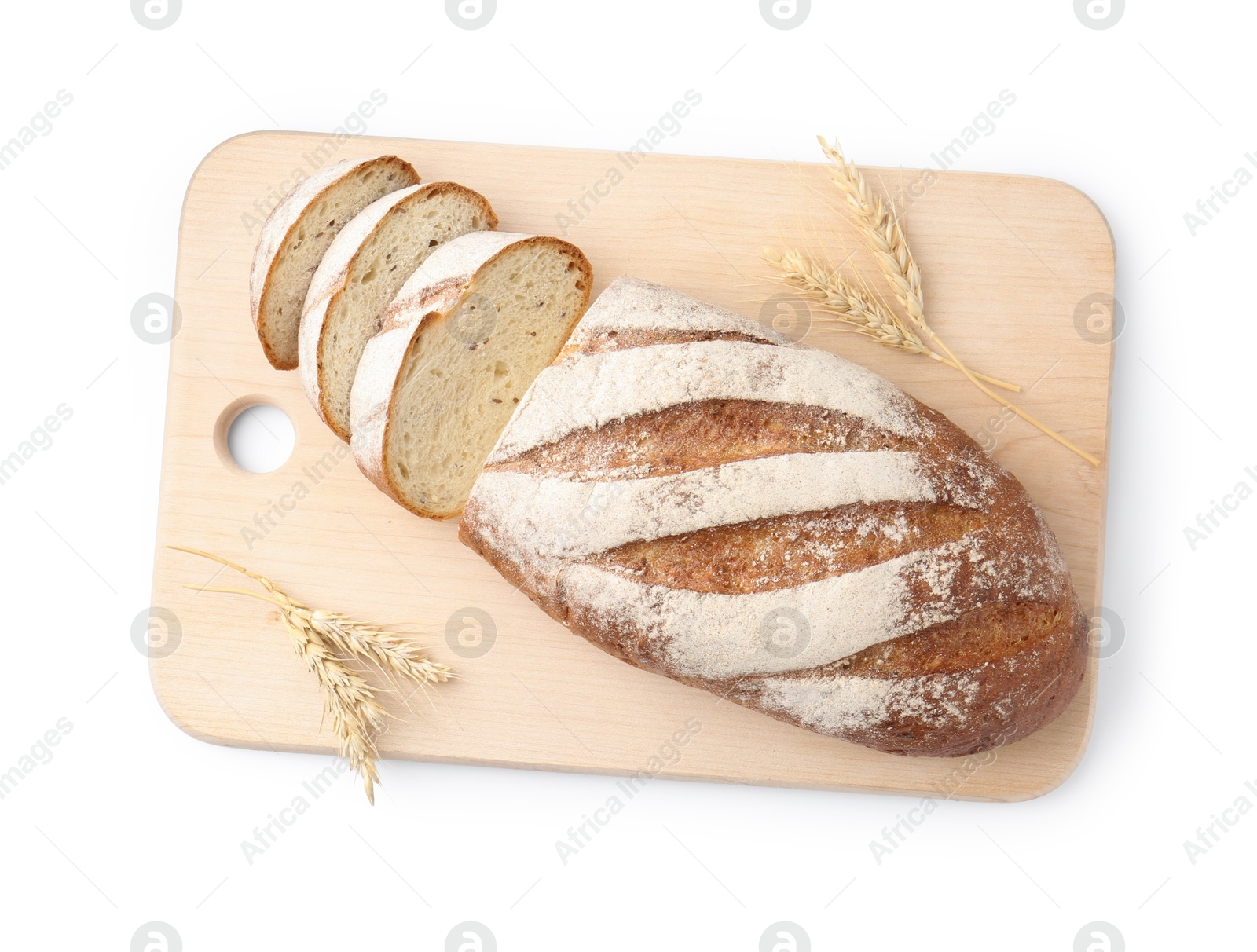 Photo of Wooden cutting board with fresh bread and spikes isolated on white, top view