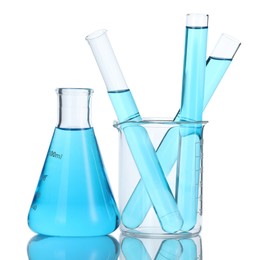 Photo of Laboratory glassware with blue liquid isolated on white