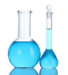 Photo of Flasks with blue liquid isolated on white. Laboratory glassware