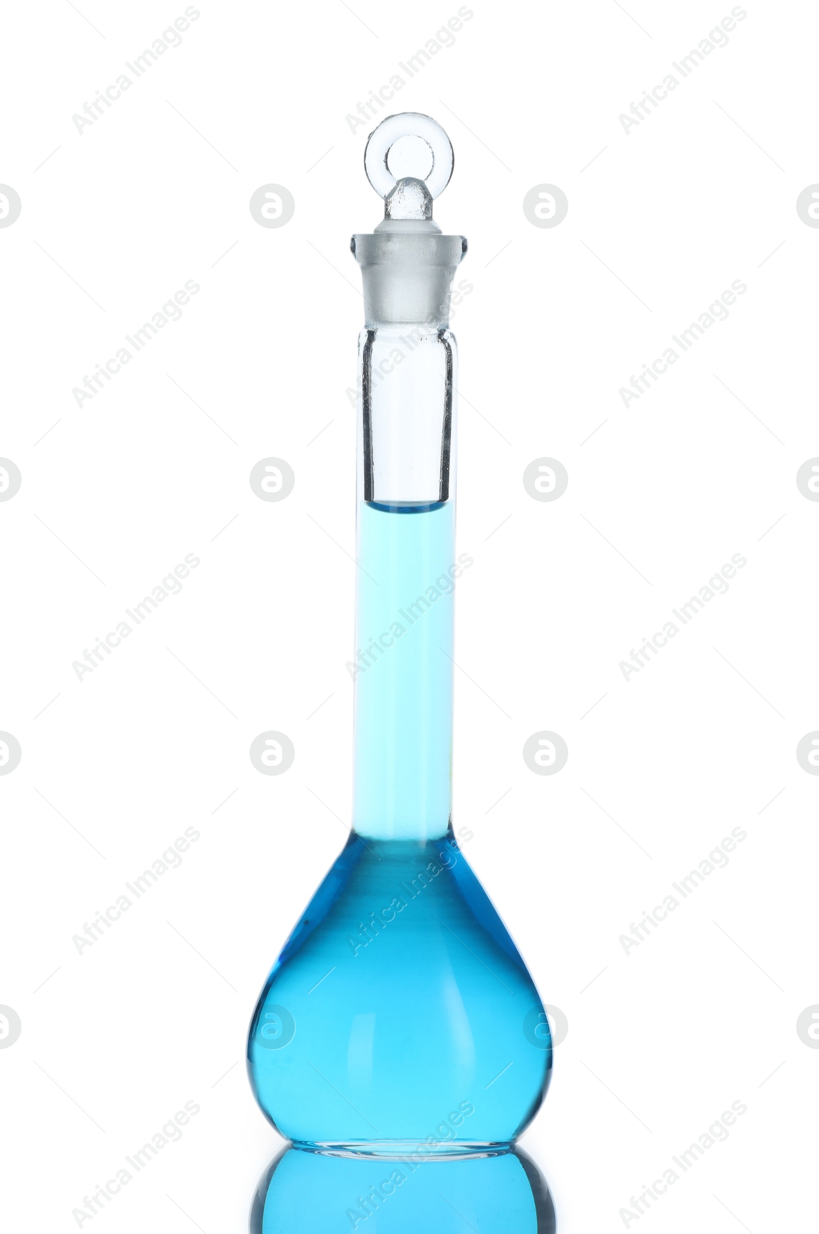 Photo of Volumetric flask with blue liquid isolated on white