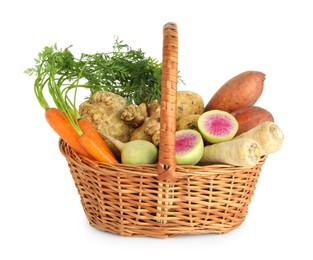 Photo of Different root vegetables in wicker basket isolated on white