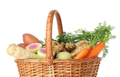 Photo of Different root vegetables in wicker basket isolated on white