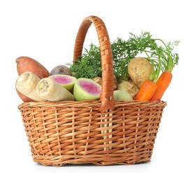 Photo of Different root vegetables in wicker basket isolated on white