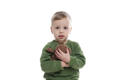 Photo of Cute little boy with toy bear on white background