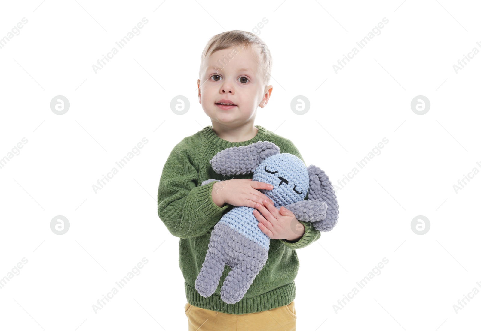 Photo of Cute little boy with toy bunny on white background