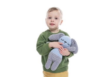 Photo of Cute little boy with toy bunny on white background