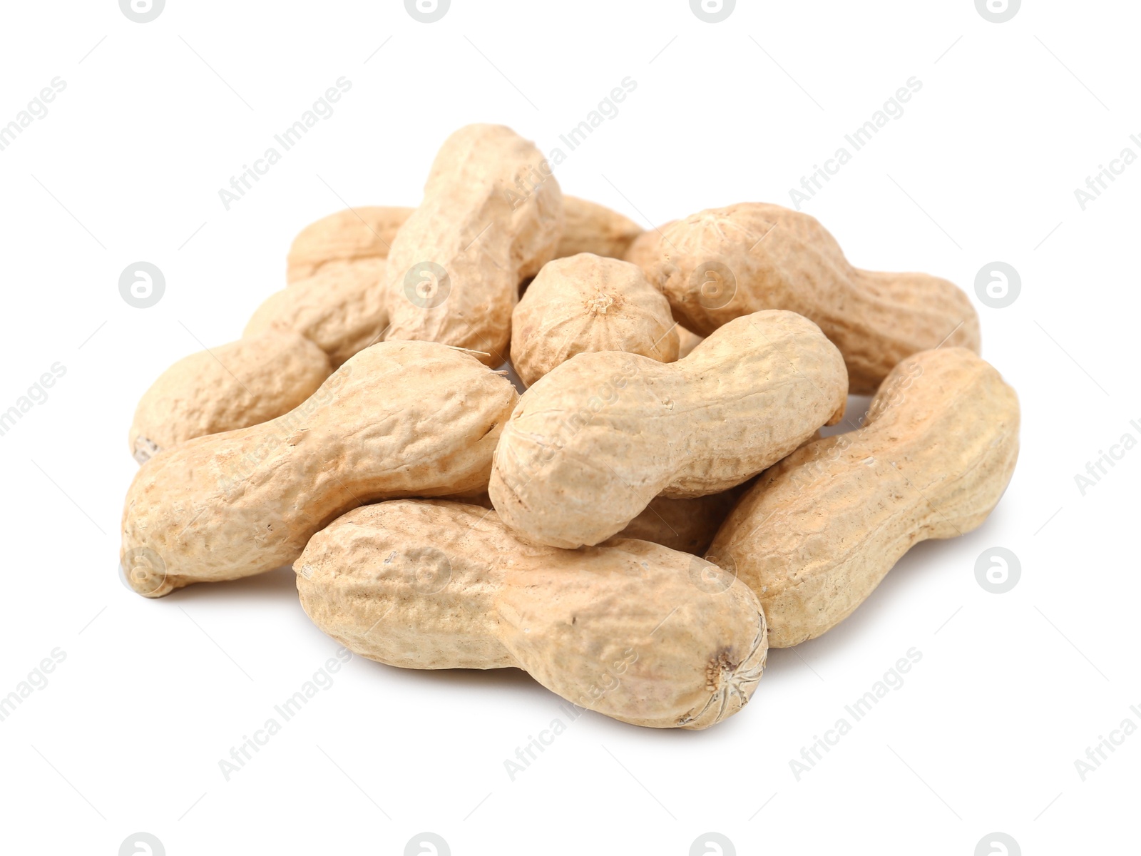 Pile of unpeeled peanuts isolated on white Photo of Pile of unpeeled peanuts isolated on white