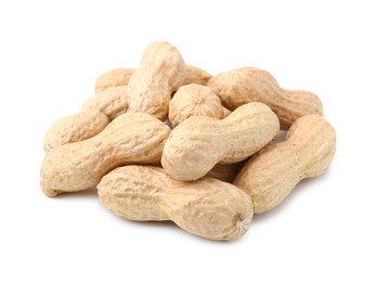 Photo of Pile of unpeeled peanuts isolated on white