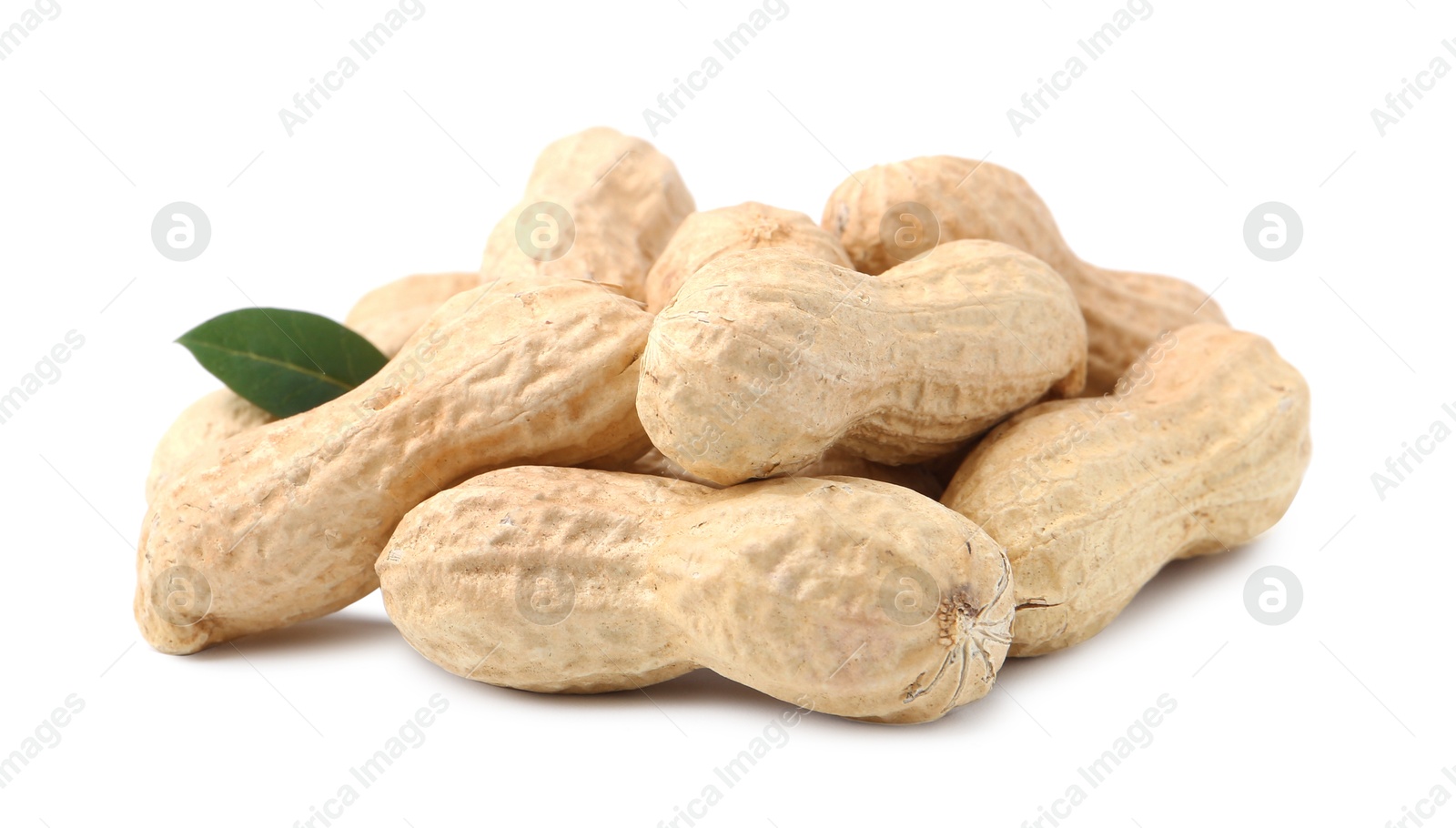 Pile of unpeeled peanuts isolated on white Photo of Pile of unpeeled peanuts isolated on white
