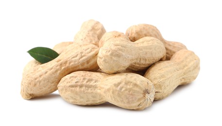 Photo of Pile of unpeeled peanuts isolated on white