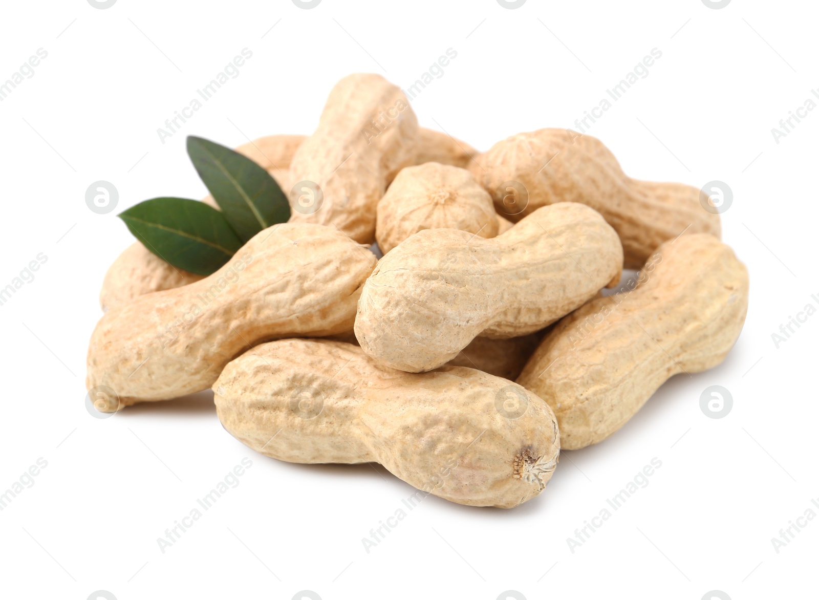 Pile of unpeeled peanuts isolated on white Photo of Pile of unpeeled peanuts isolated on white