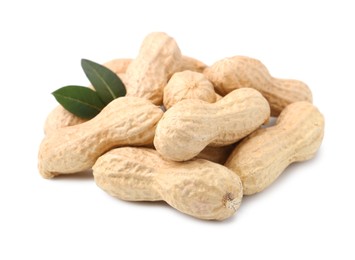 Photo of Pile of unpeeled peanuts isolated on white