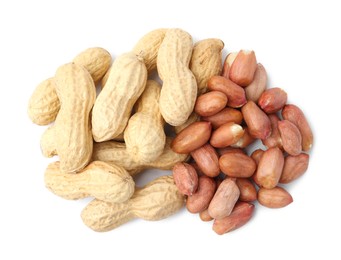 Photo of Pile of different peanuts isolated on white, top view