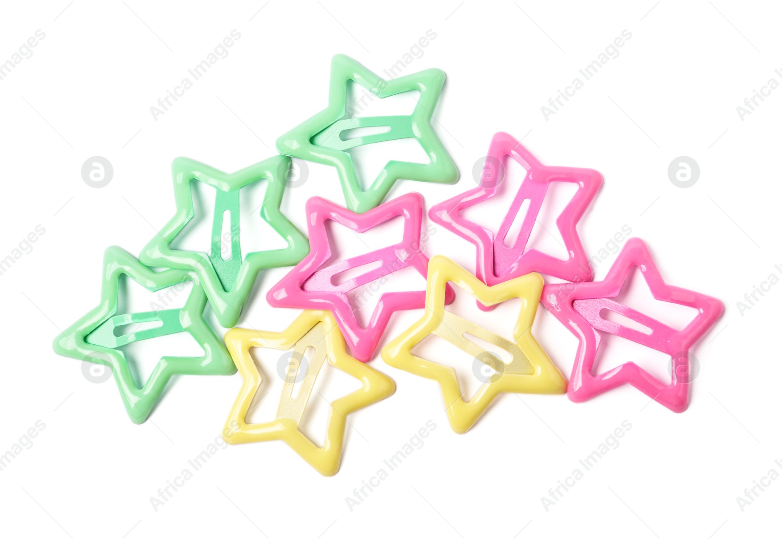 Photo of Many colorful star shaped hair clips isolated on white, top view