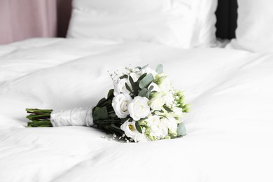 Photo of Wedding bouquet of beautiful flowers on bed indoors