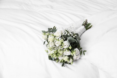 Photo of Wedding bouquet of beautiful flowers on linens. Space for text