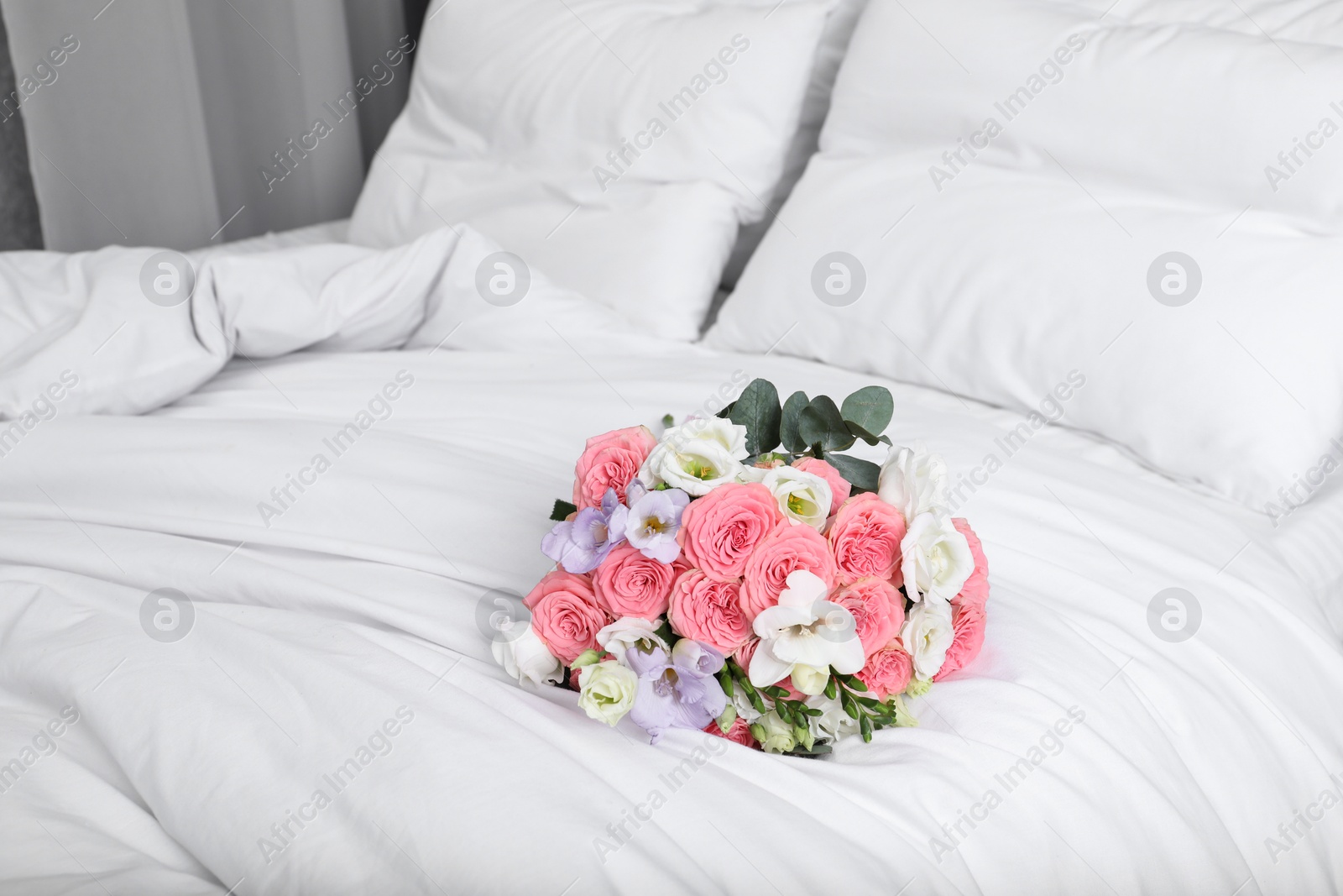 Photo of Wedding bouquet of beautiful flowers on bed