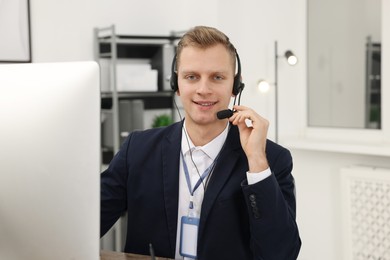 Photo of Technical support call center. Portrait of smiling operator in office