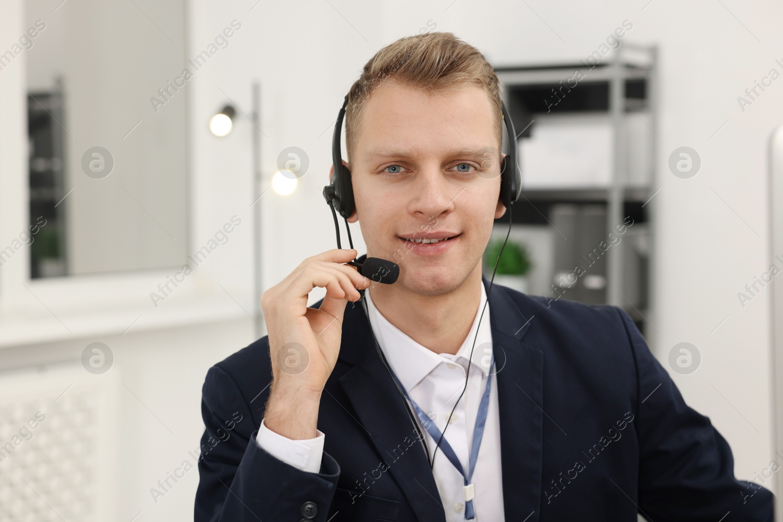 Photo of Technical support call center. Portrait of smiling operator in office