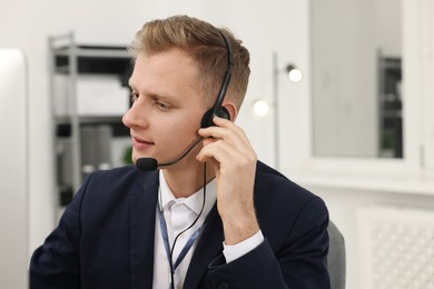 Photo of Technical support call center. Operator working in office