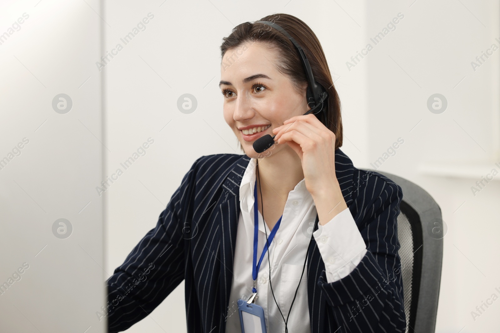 Photo of Technical support call center. Portrait of smiling operator in office