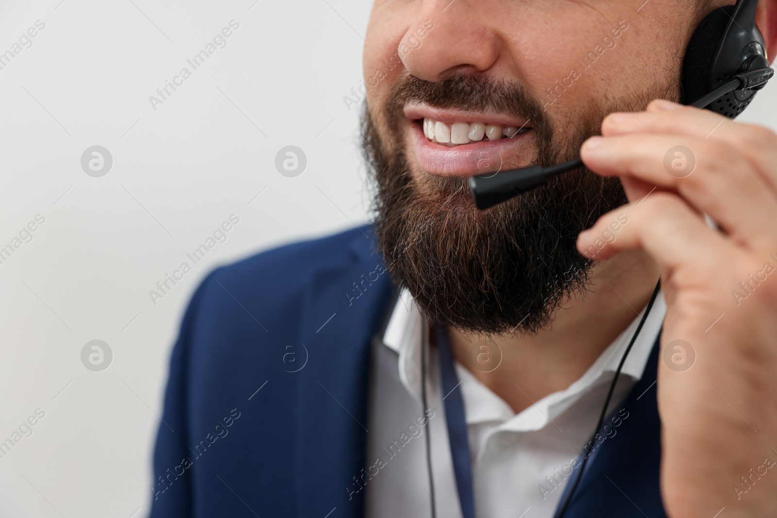 Photo of Technical support call center. Smiling operator working indoors, closeup. Space for text