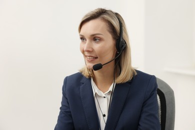 Photo of Technical support call center. Portrait of smiling operator in office