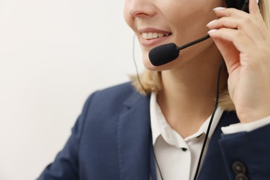 Photo of Technical support call center. Smiling operator working indoors, closeup. Space for text