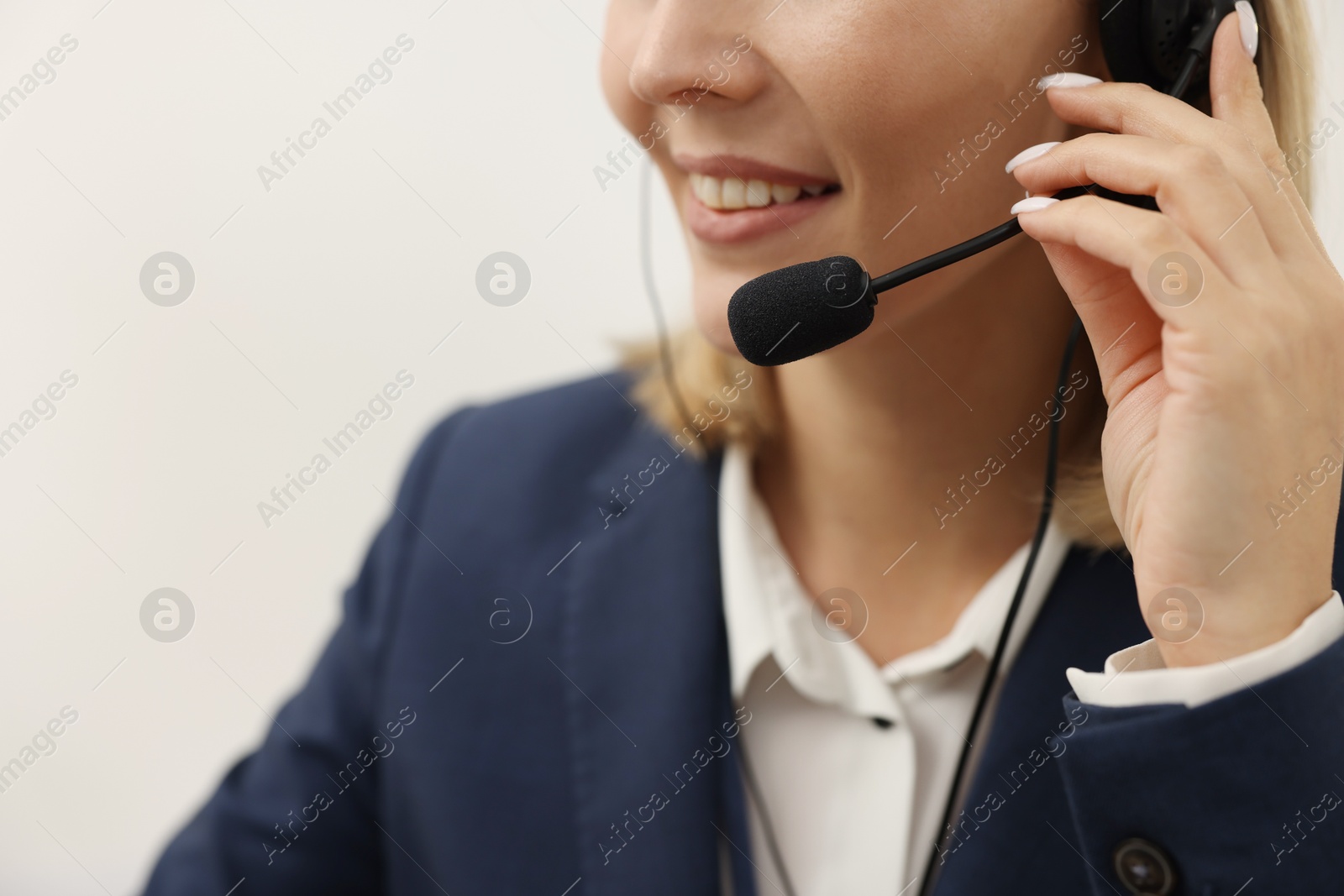 Photo of Technical support call center. Smiling operator working indoors, closeup. Space for text