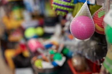 Photo of Toys on display in pet shop, closeup. Space for text