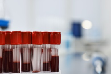 Photo of Tubes with blood samples in laboratory, closeup. Space for text