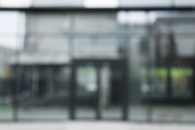 Blurred view of modern building with many windows outdoors