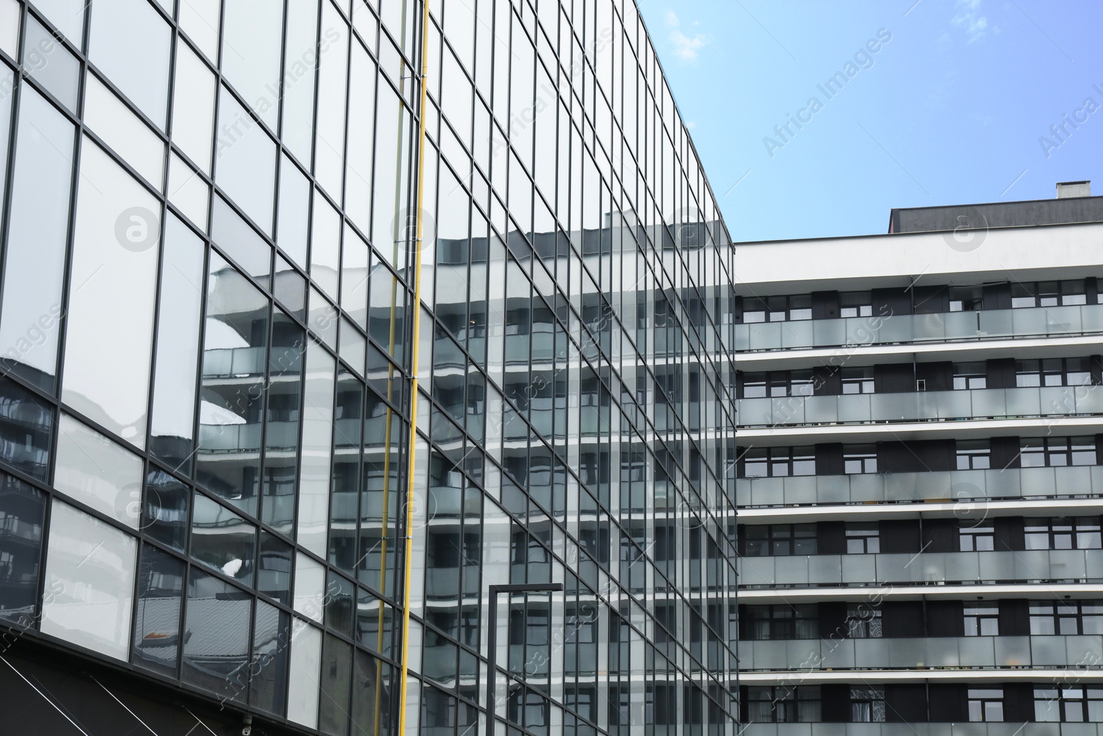 Photo of Modern buildings with many windows on city street