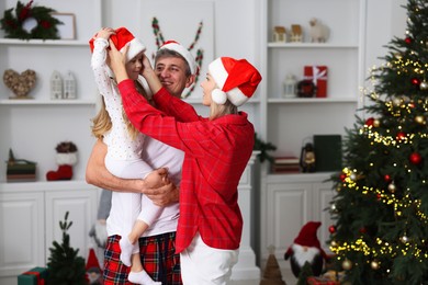 Photo of Lovely family spending Christmas together at home