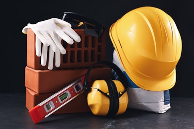 Photo of Different construction material and tools on grey table