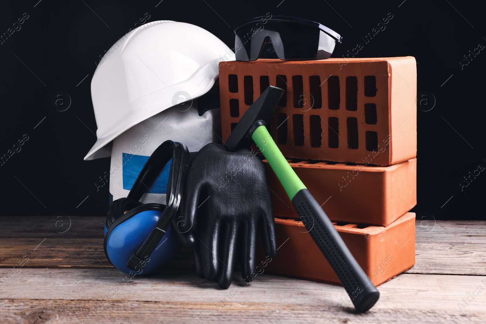 Photo of Different construction material and tools on wooden table