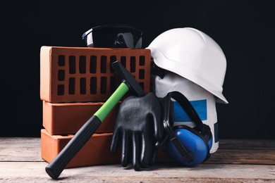 Photo of Different construction material and tools on wooden table