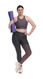 Photo of Plus size woman in gym clothes with fitness mat on white background