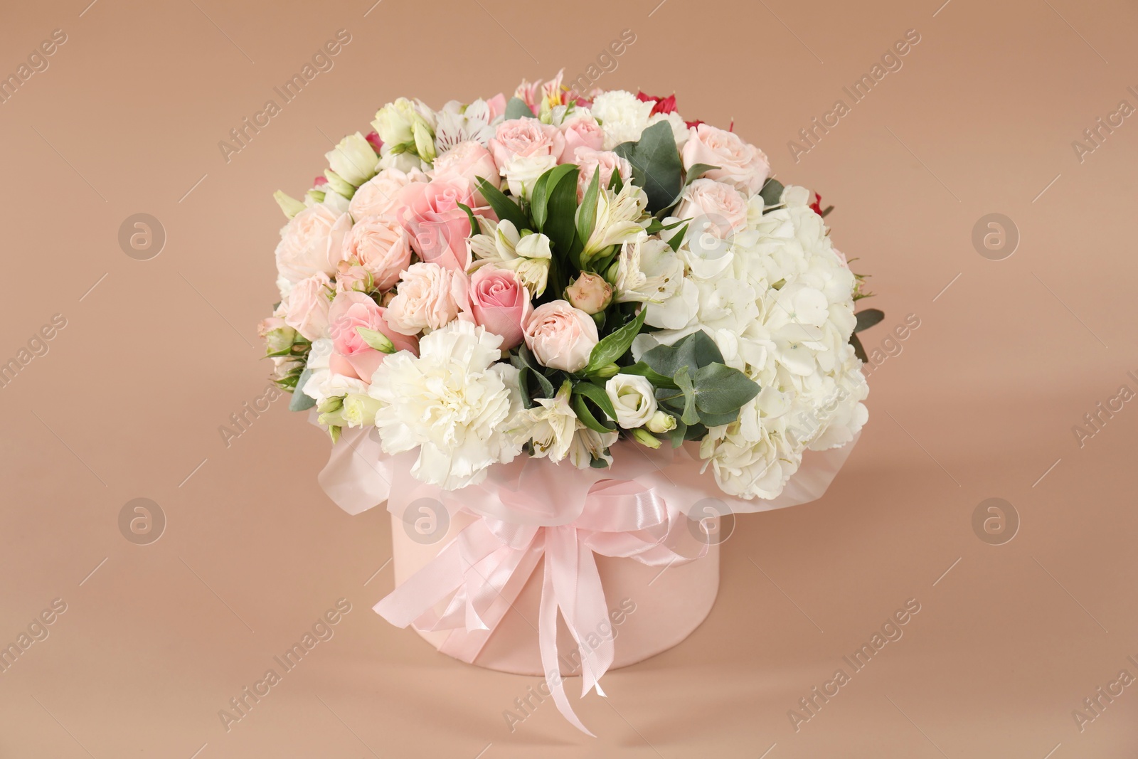 Photo of Bouquet of beautiful flowers on beige background