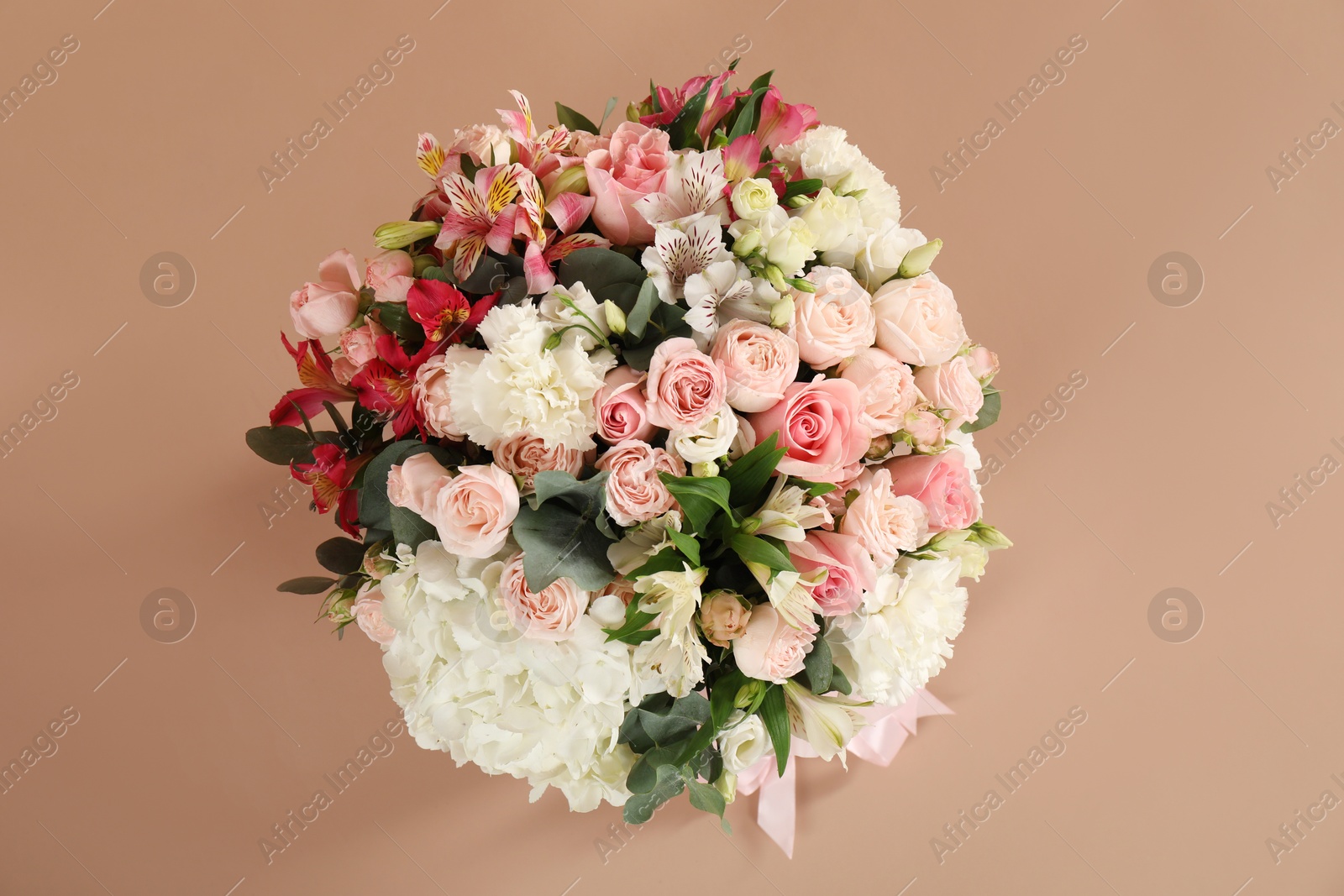 Photo of Bouquet of beautiful flowers on beige background, top view