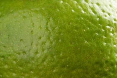 Photo of Fresh lime zest as background, macro view