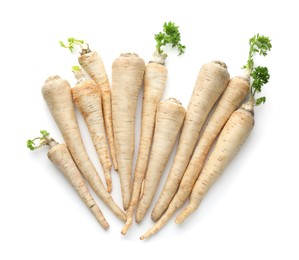 Photo of Many fresh parsley roots isolated on white, top view