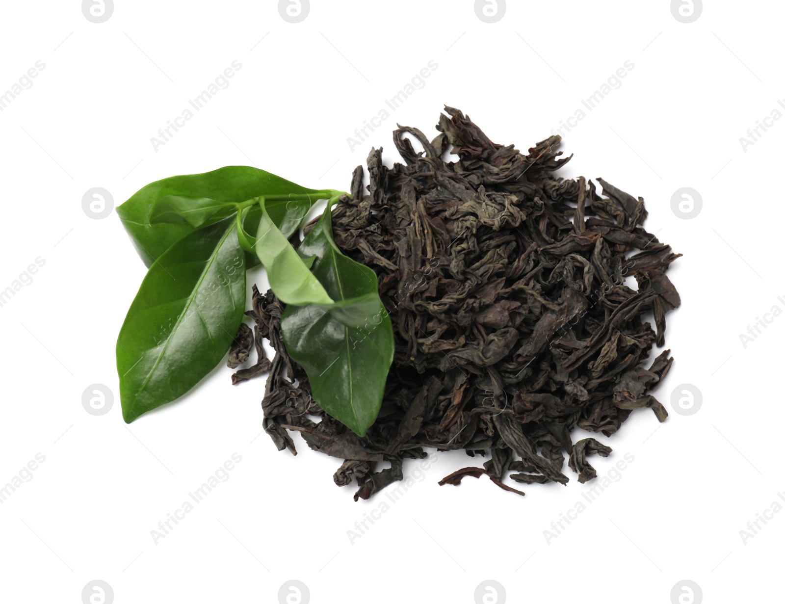 Photo of Pile of dried tea leaves isolated on white, top view