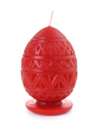 Photo of Red egg-shaped candle isolated on white. Easter decor